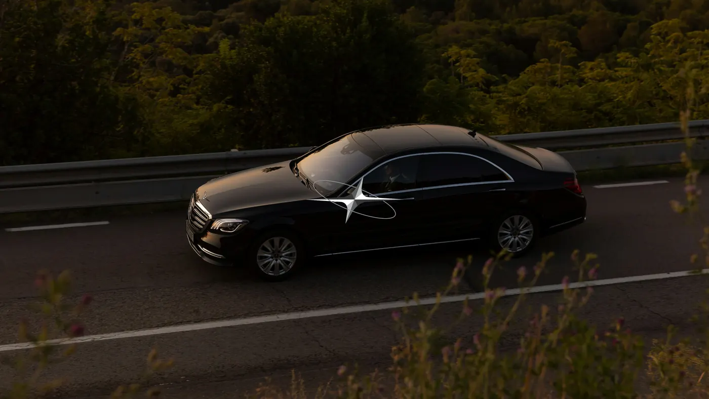 Luxurati brand visual of a car photographed on an open road