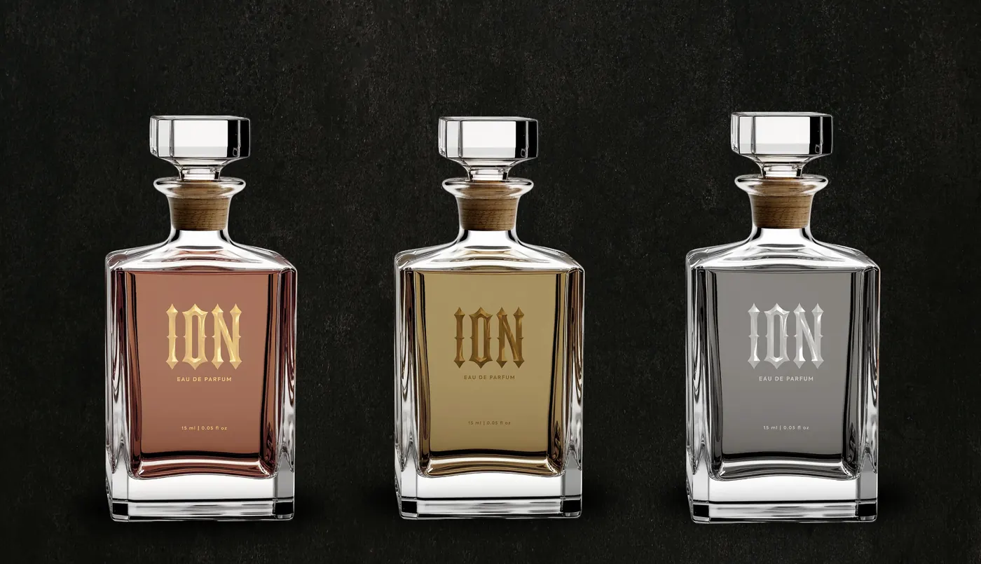 Three ION decanters rendered in a dark studio setting