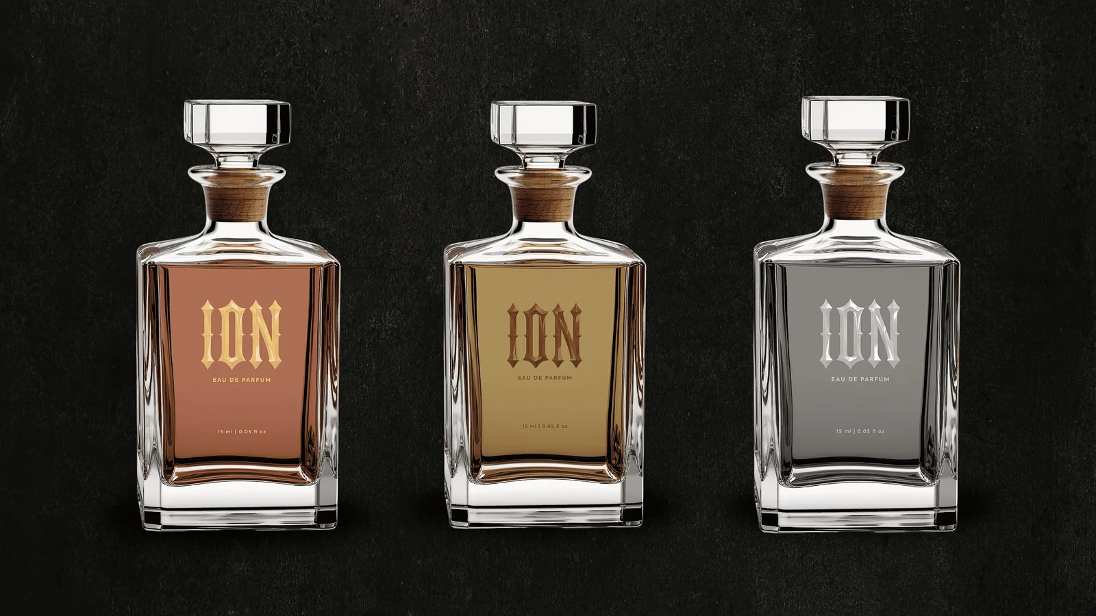 Three Ion crystal perfume decanters in amber, gold and grey