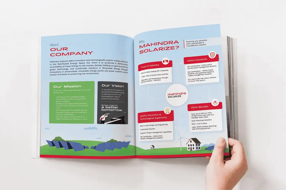 Hand turning the pages of the brochure to an Our Company spread