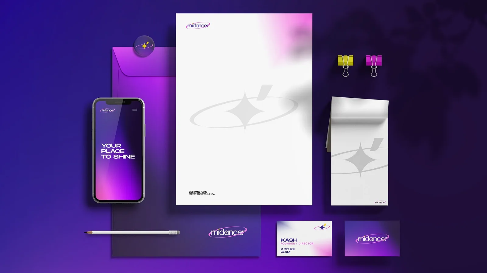 Purple stationery flat lay with phone, letterhead, notepad and cards