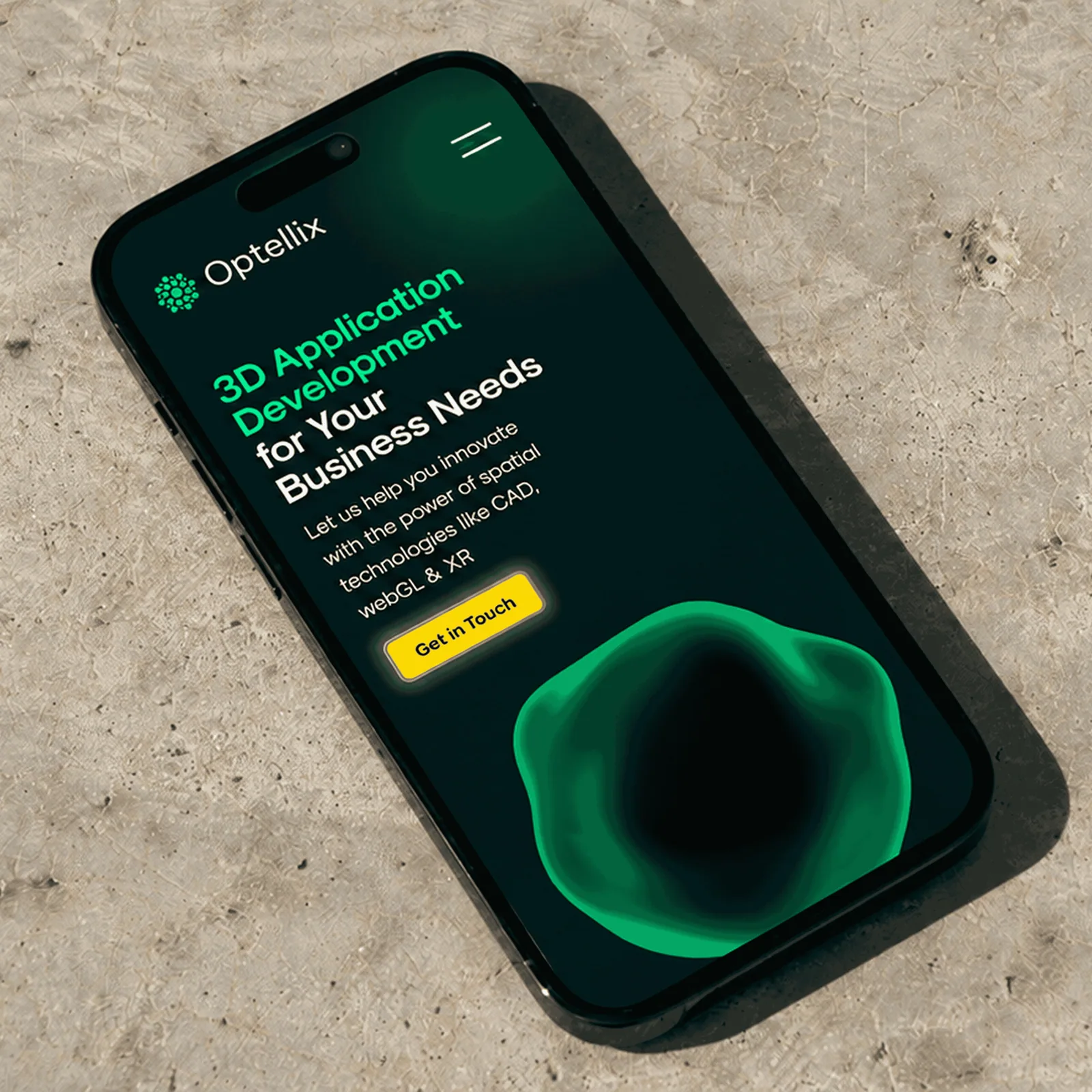 Phone on a stone surface showing the Optellix mobile homepage