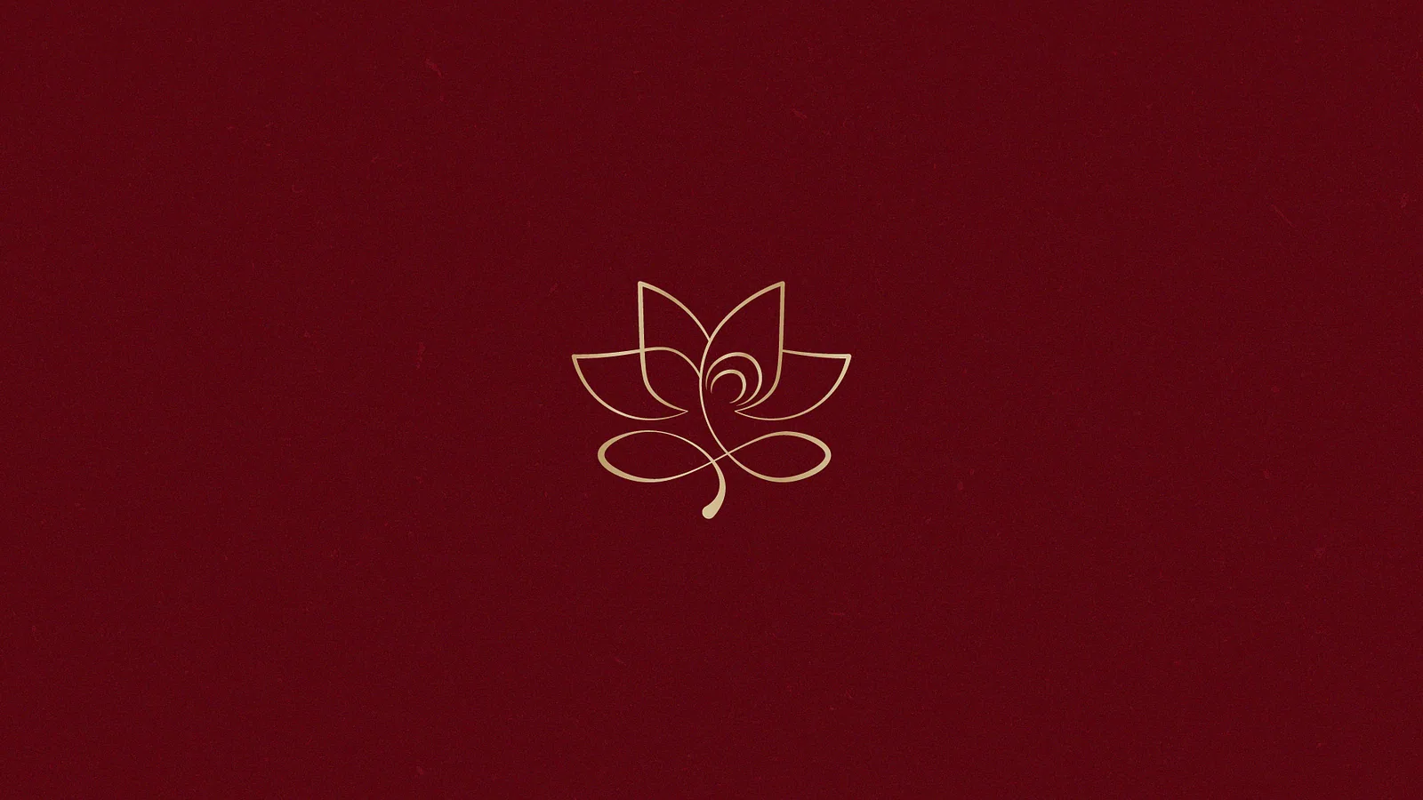 Gold line-art lotus symbol centred on a deep maroon field